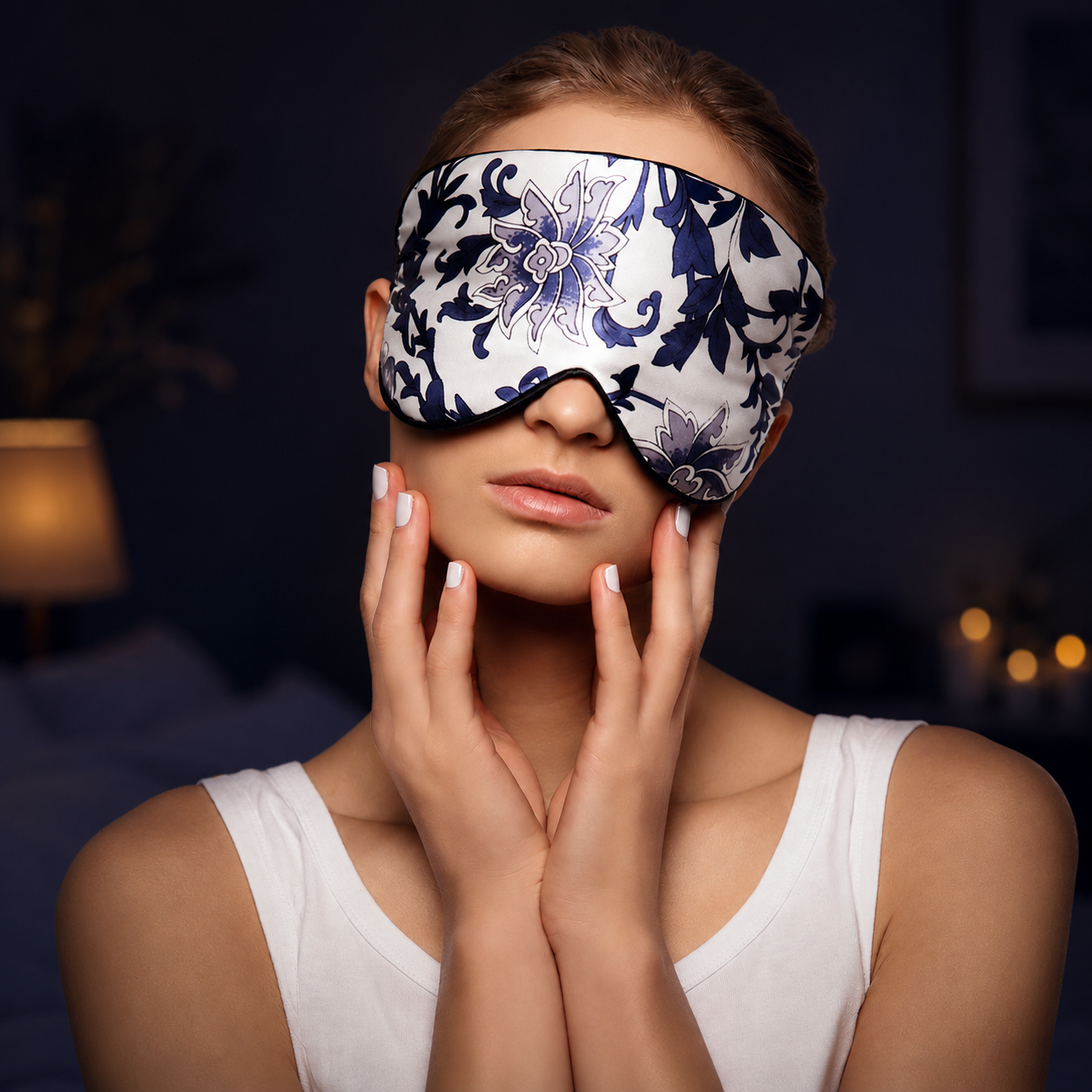 Woman wearing a floral sleep mask with a dark background
